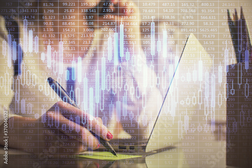 Wallpaper Mural Double exposure of woman hands typing on computer and financial graph hologram drawing. Stock market analysis concept. Torontodigital.ca