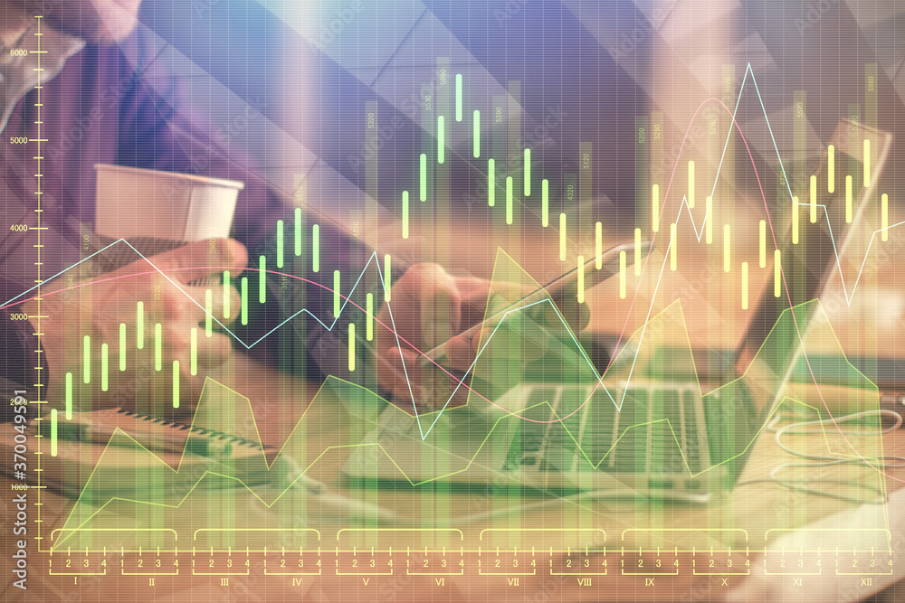 Double exposure of man's hands holding and using a phone and financial graph drawing. Analysis concept. Double exposure of man's hands holding and using a phone and financial graph drawing. Analysis concept.