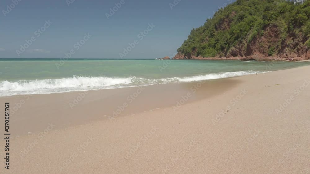 Waves breaking on the pebbles close up. Sea surf. Waves runs on coastal pebble. summer day sea and coast holiday concept Waves breaking on the pebbles close up. Sea surf. Waves runs on coastal pebble. summer day sea and coast holiday concept