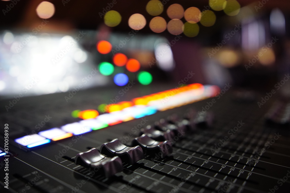 Black audio sound mixer with sliders button. Bokeh background Black audio sound mixer with sliders button. Bokeh background