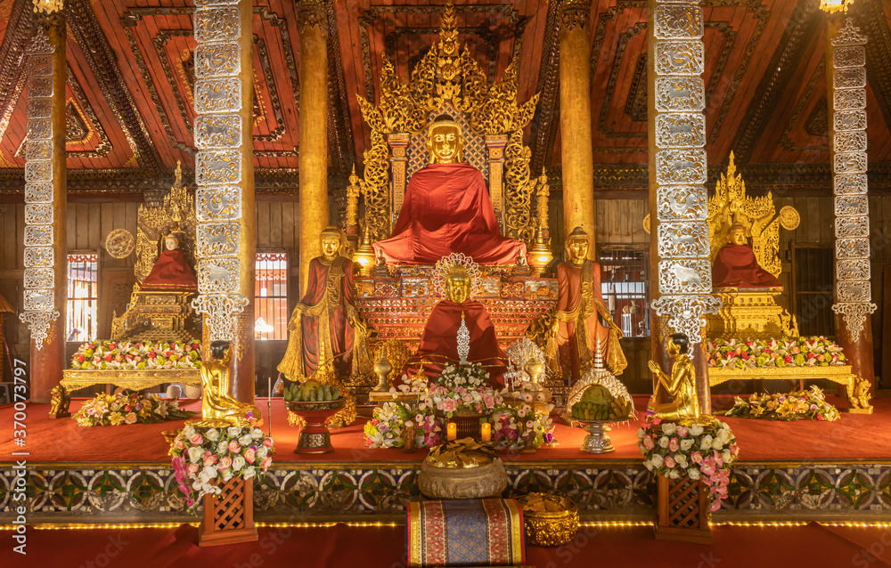 Phayao, Thailand - Dec 31, 2019: Myanmar Buddha and Follower Statue in Church of Wat Nantaram or Nantaram Temple at Chiang Kham District Phayao Thailand