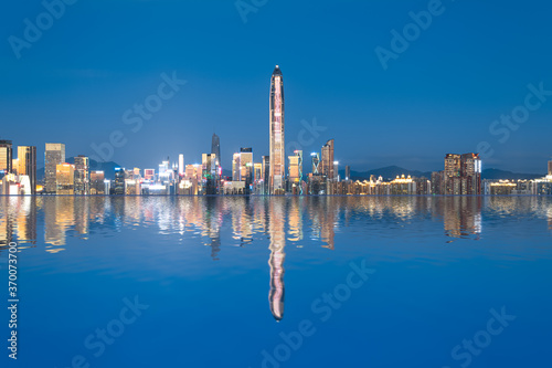 Night view and water reflection of urban skyline in Futian District, Shenzhen