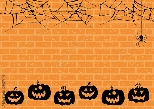 蜘蛛の巣とカボチャのハロウィンの背景