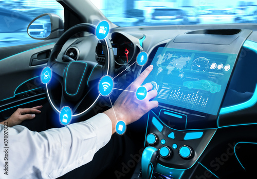 Driverless car interior with futuristic dashboard for autonomous control system . Inside view of cockpit HUD technology using AI artificial intelligence sensor to drive car without people driver . photo