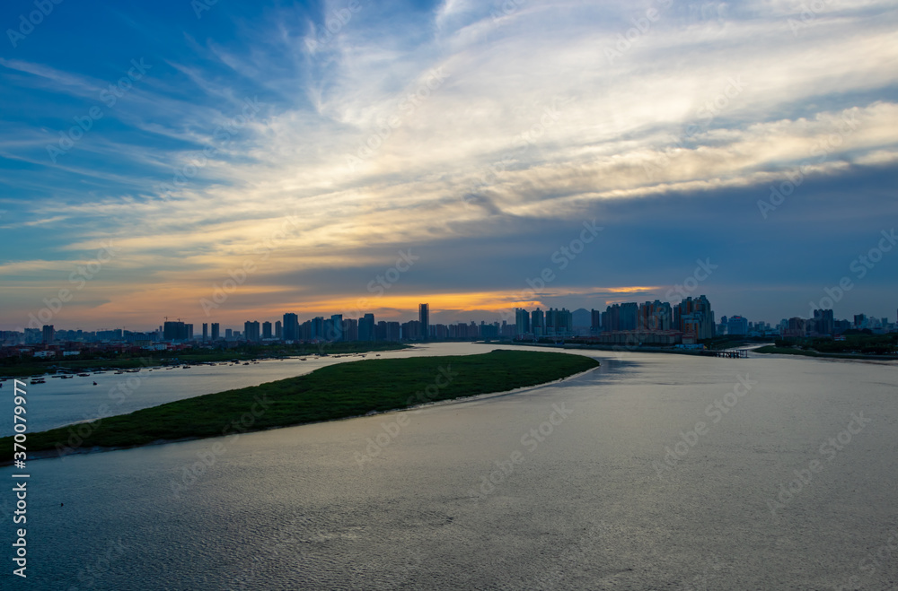 On August 7, 2020, the scenery of Quanzhou Bay in China. Urban architecture by the river.