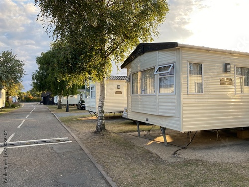 UK Holiday Park on the England East Coast, traditional United Kingdom holiday park with caravans and bungalows houses in a sunny summer day at dusk