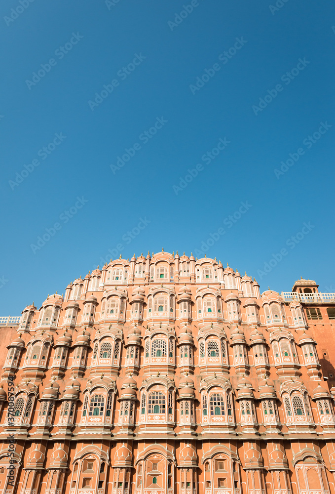 Facade of Hawa Mahal with blue sky in Jaipur, India