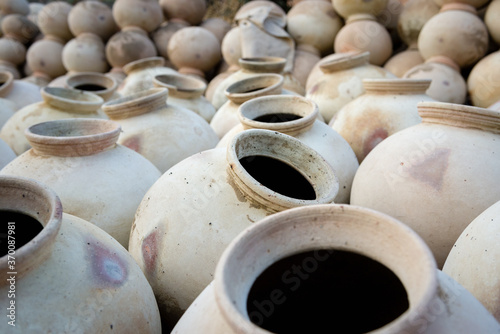 Handmade clay pots in rows