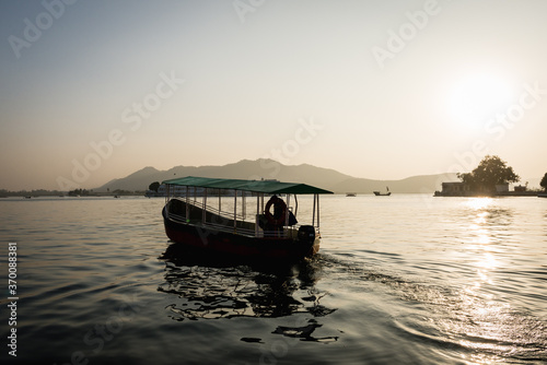 Boat on Lake Pichola at sunset in Udaiur  India