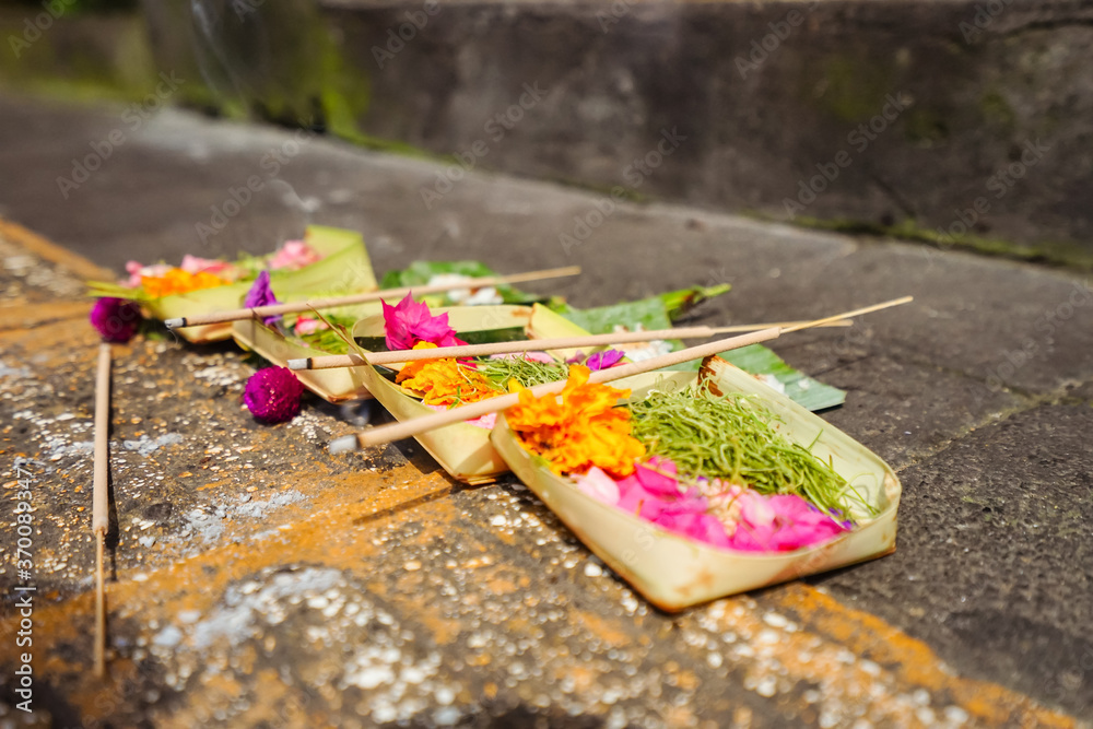 Traditional Buddhist wreath with incense in Ubud