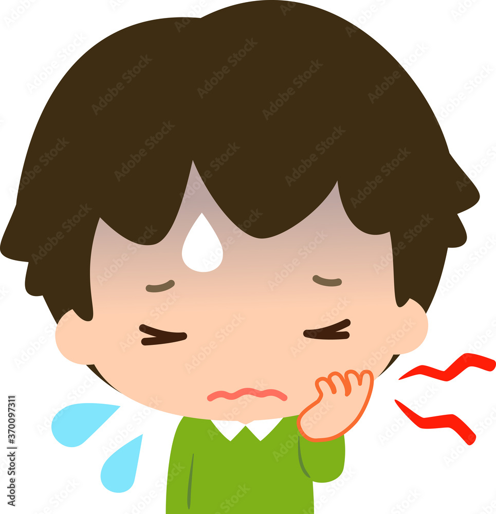 辛そうな表情で片頬を押さえる男の子 辛そうな表情で片頬を押さえる男の子