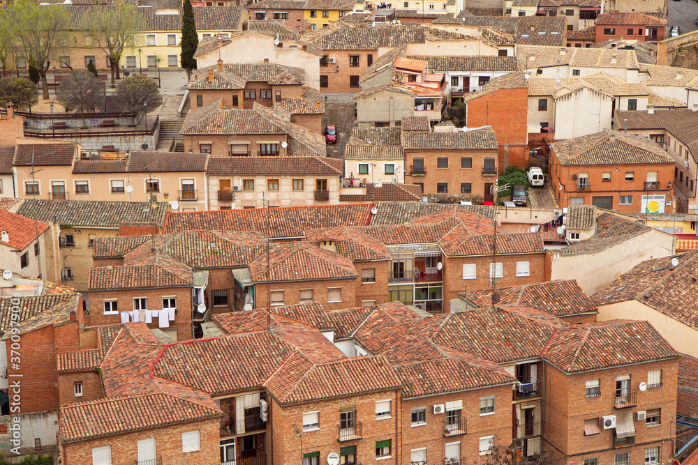 European city. Urban architecture. Old buildings, apartments and houses in the historical town of Toledo, Spain. 