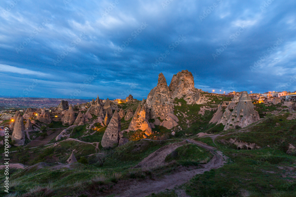 Obraz premium Limestone rock formations under dramatic storm clouds, in Cappadocia, Turkey