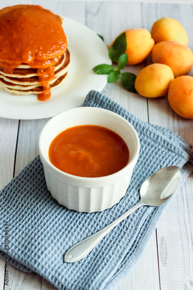 Homemade apricot jam. Pancakes with apricot jam. Honey, food. Homemade apricot jam. Pancakes with apricot jam. Honey, food.