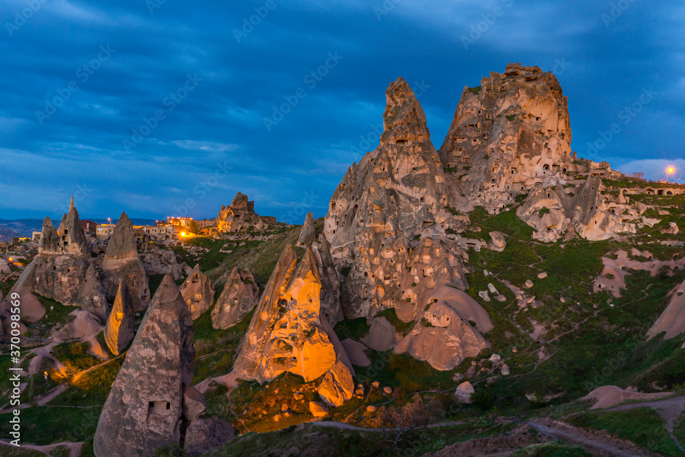 Limestone rock formations under dramatic storm clouds, in Cappadocia, Turkey