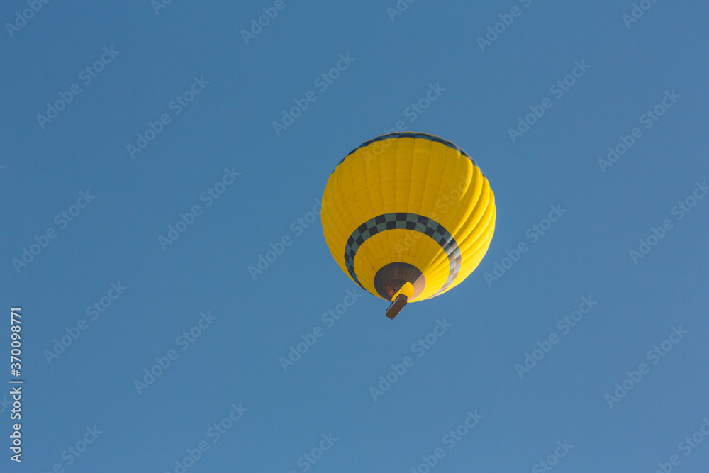 Fototapeta premium Hot air balloons profiled on clear blue sky, in Cappadocia, Turkey