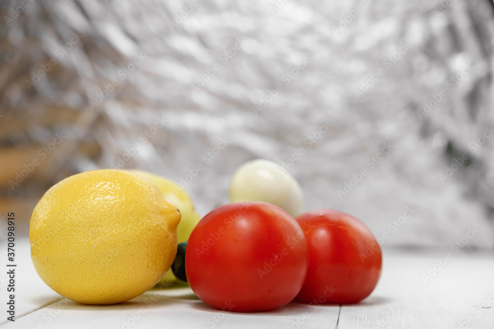 vegetable set. tomatoes and lemon on a sparkling background vegetable set. tomatoes and lemon on a sparkling background