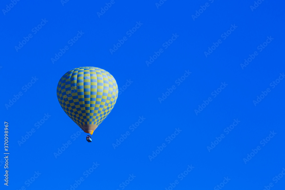 Naklejka premium Hot air balloons profiled on clear blue sky, in Cappadocia, Turkey
