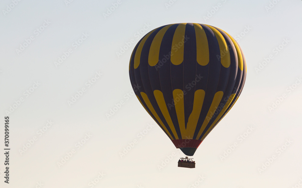 Fototapeta premium Hot air balloons profiled on clear blue sky, in Cappadocia, Turkey