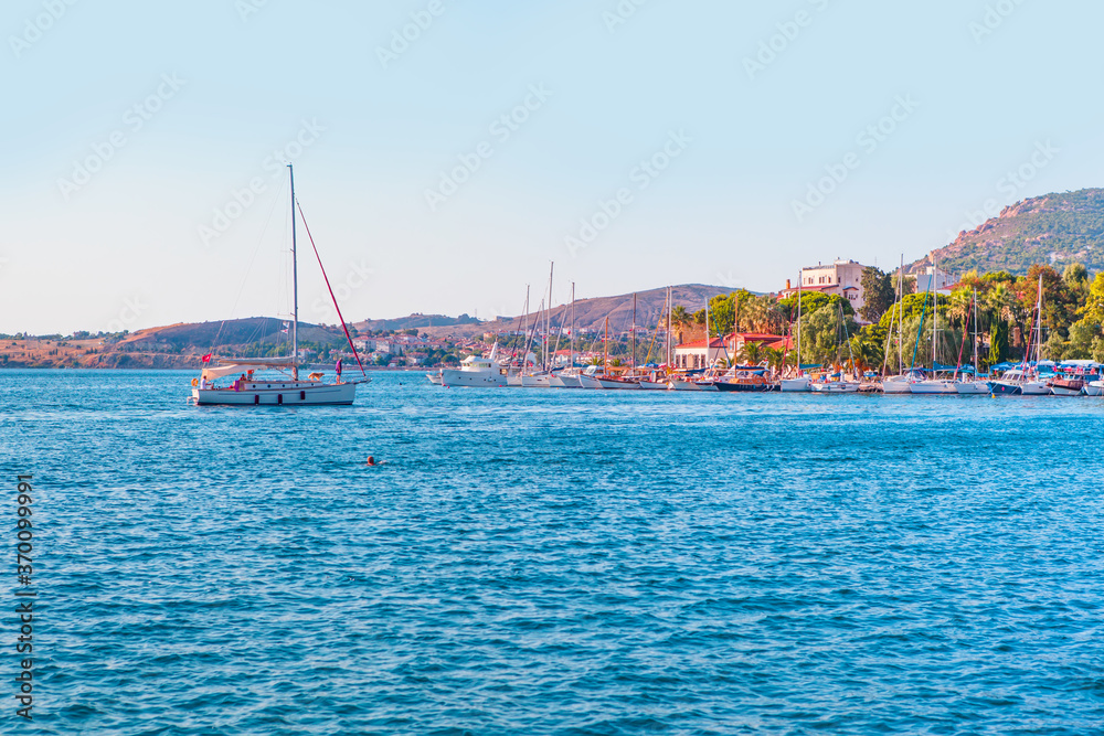 Many boats in the marina with coastline of resort town of Foca - Izmir, Turkey