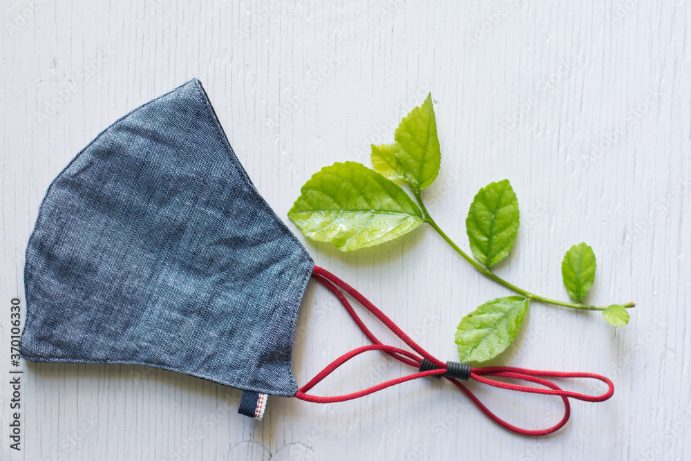 Modern mask and corona virus protection,Fresh mask cloth on a wood background.