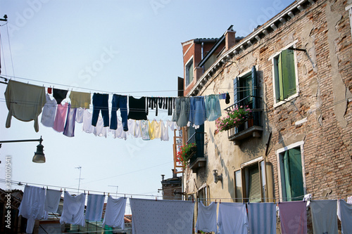 house drying clothes in the street