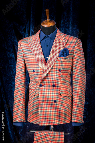 Men's business suit on mannequin, vintage color. elegant plaid suit with pocket square