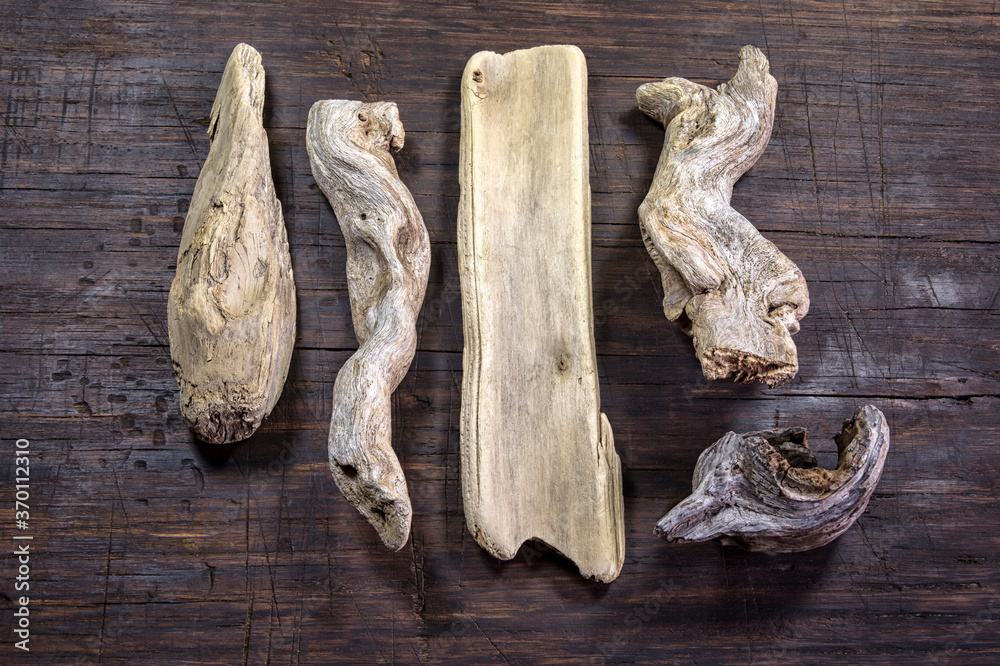 Some dry wooden pieces on the wooden table.