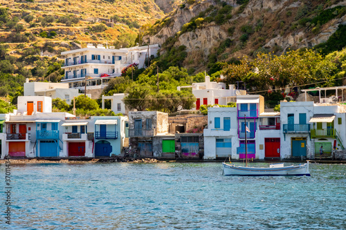 Klima fishermen village on Milos Island - the most colorful fishing village in Greece, with colorful doors, window shutters and balconies and traditional whitewashed walls, landscape view on sunny day