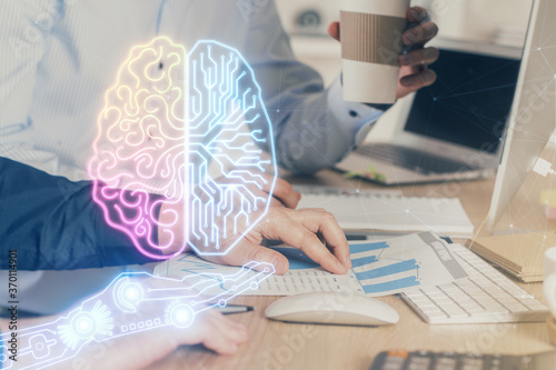 Man with computer background with brain theme hologram. Concept of brainstorm. Double exposure.