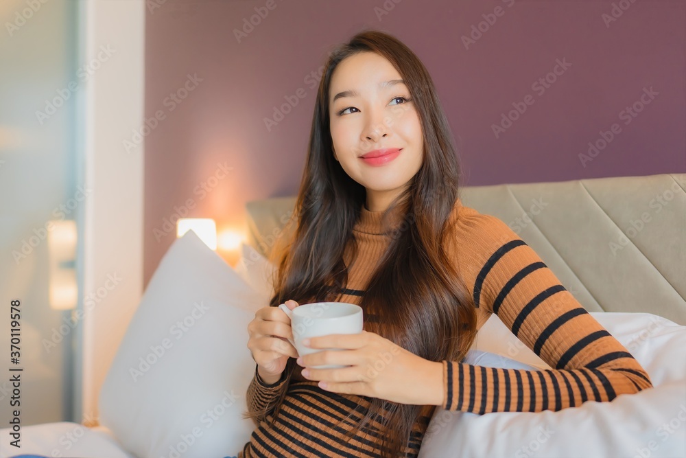 Portrait beautiful young asian woman with coffee cup on bed Portrait beautiful young asian woman with coffee cup on bed