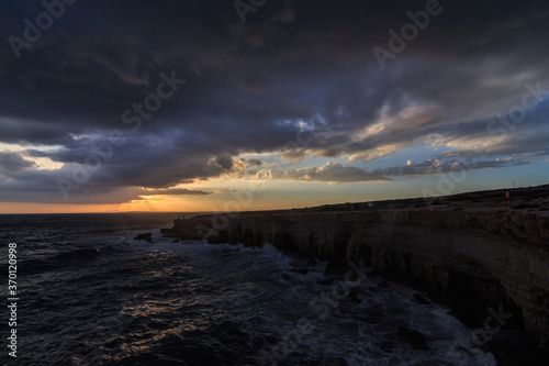 Stormy Weather sunset at sea Caves in Cape Grego Ayia Napa  Cyprus 