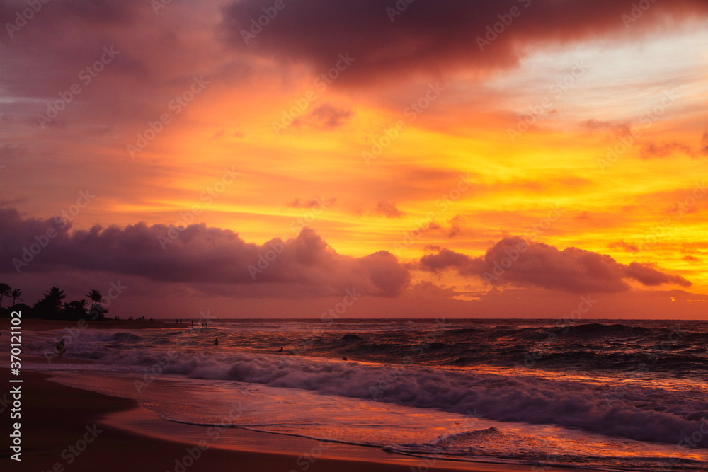 Beautiful clouds and sun rising at the beach in Hawaii