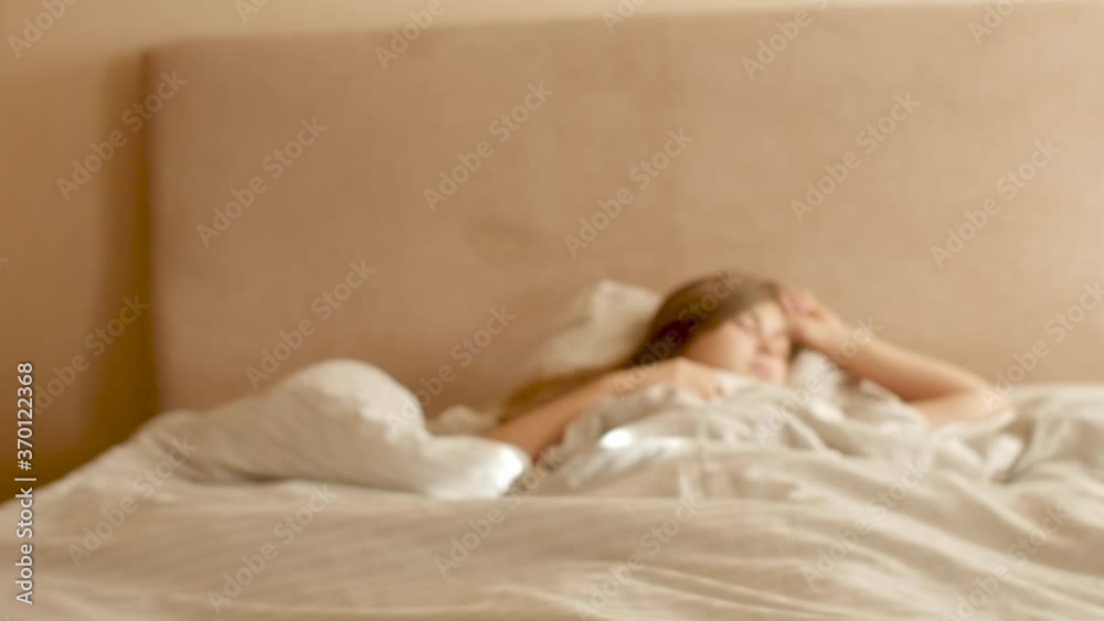 young woman awakening,sipping fingers on legs and stand up from bed, girl resting lying, morning routine young woman awakening,sipping fingers on legs and stand up from bed, girl resting lying, morning routine