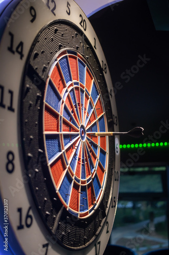 Pikado darts game with the arrow in the middle AM Stock Photo | Adobe Stock