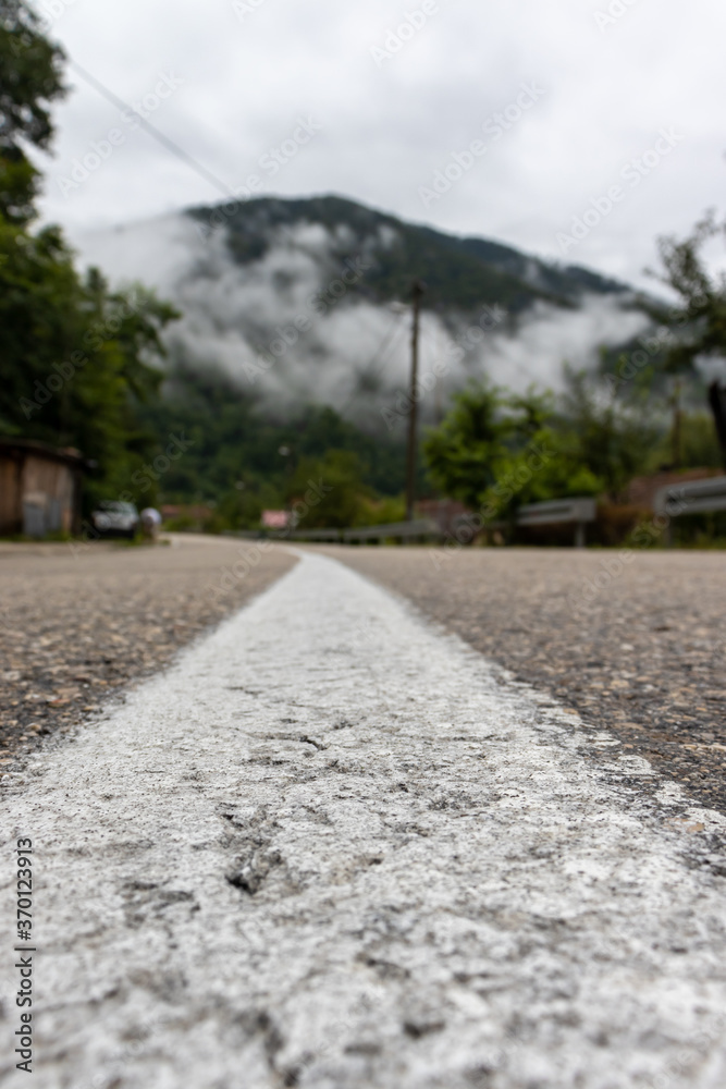 Close up low angle shot of the road with the stripe lines on it AM Close up low angle shot of the road with the stripe lines on it AM