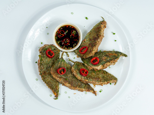 Korean food : Kkaennipjeon. Half-folded perilla leaves stuffed with a mixture of minced meat and vegetables, egg-battered, and pan-fried.  Korean ritual food usually eaten on holidays.