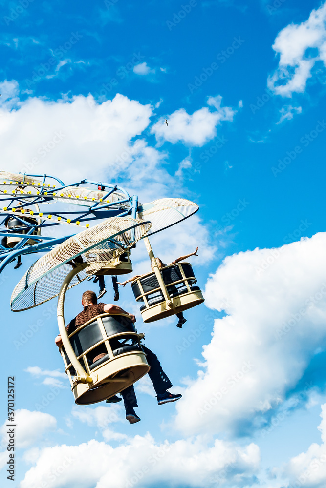 Ride carousel in motion in amusement park at sunny day Ride carousel in motion in amusement park at sunny day