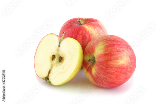 Two red apples and half isolated on white
