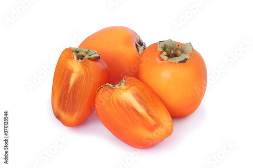 Two persimmons with two half  isolated on white background