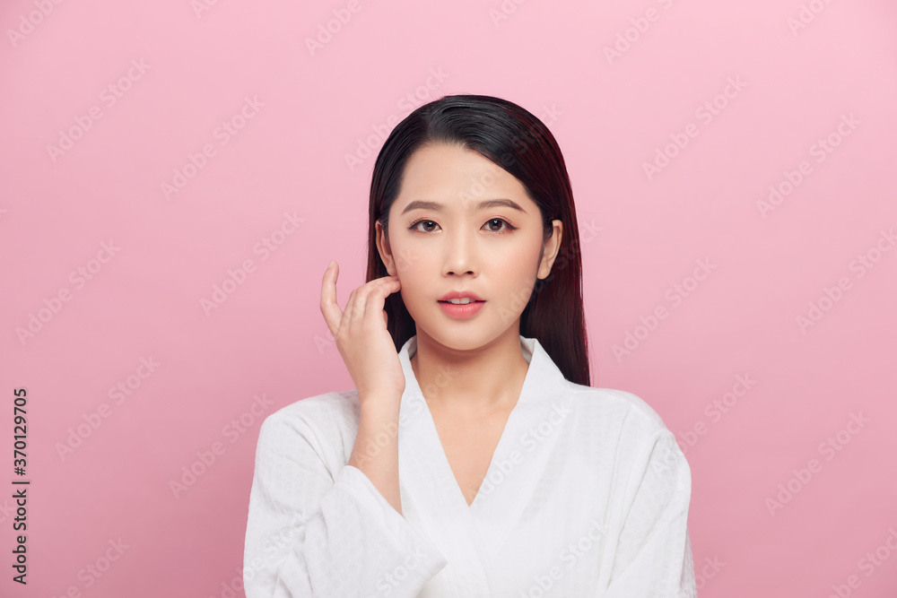 Beauty fashion portrait. Smiling young woman on pink wall background. Beauty fashion portrait. Smiling young woman on pink wall background.