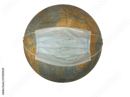 оld globe of the Earth with a protective mask isolated on a white background.