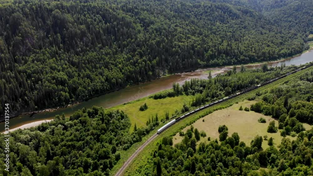 Freight train in motion from a bird's eye view.