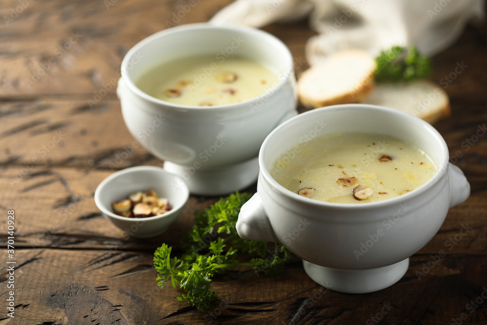 Homemade white asparagus soup with hazelnut