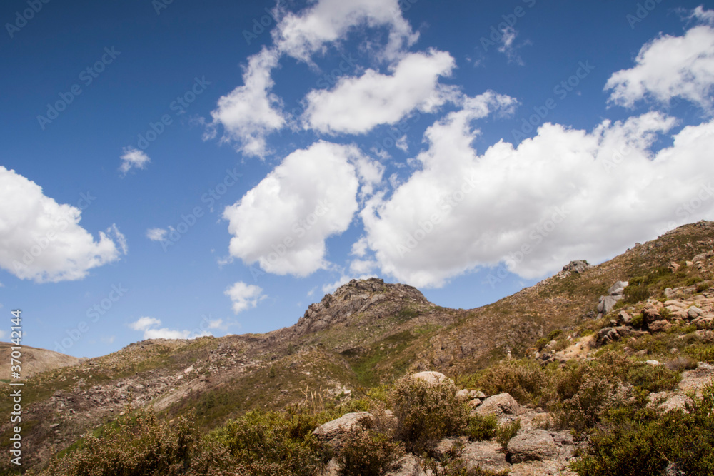 Mountain peak uphill under blue sky