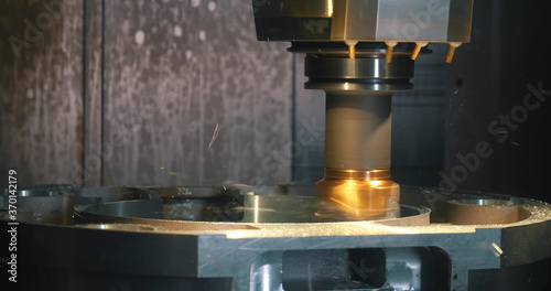 Close up of operation of lathe machine rough cutting metal parts