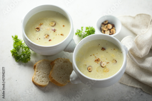 Homemade white asparagus soup with hazelnut