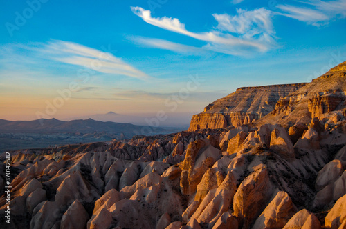 Arid dessert mountain landscape with gold and orange rocks in cappadocia  turkey