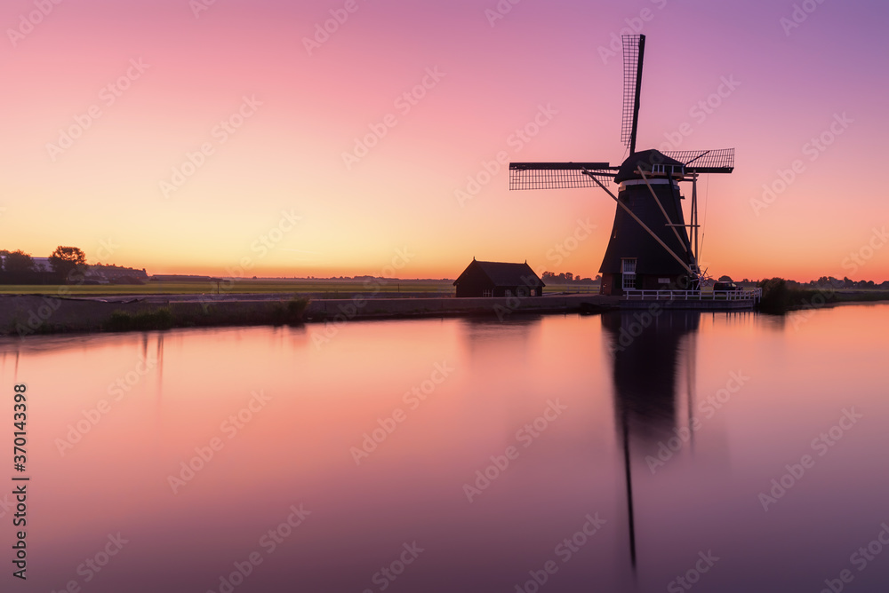 Dutch windmill just before sunrise