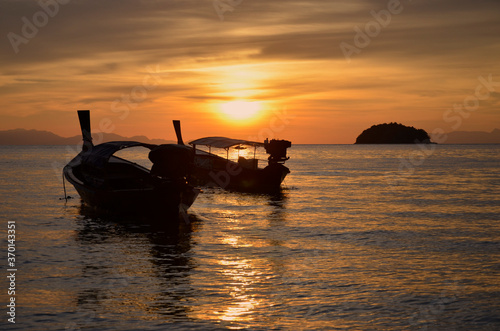 Passenger boats in scintillation sea in the evening